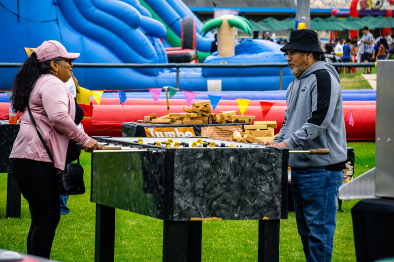 company picnic arcade and table games outdoors