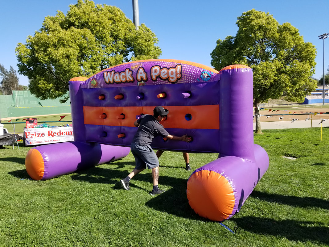 Inflatable whack-a-mole game for corporate events